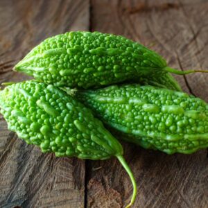 small bitter melons on vintage wooden background now buy online in Pakistan at seed beej